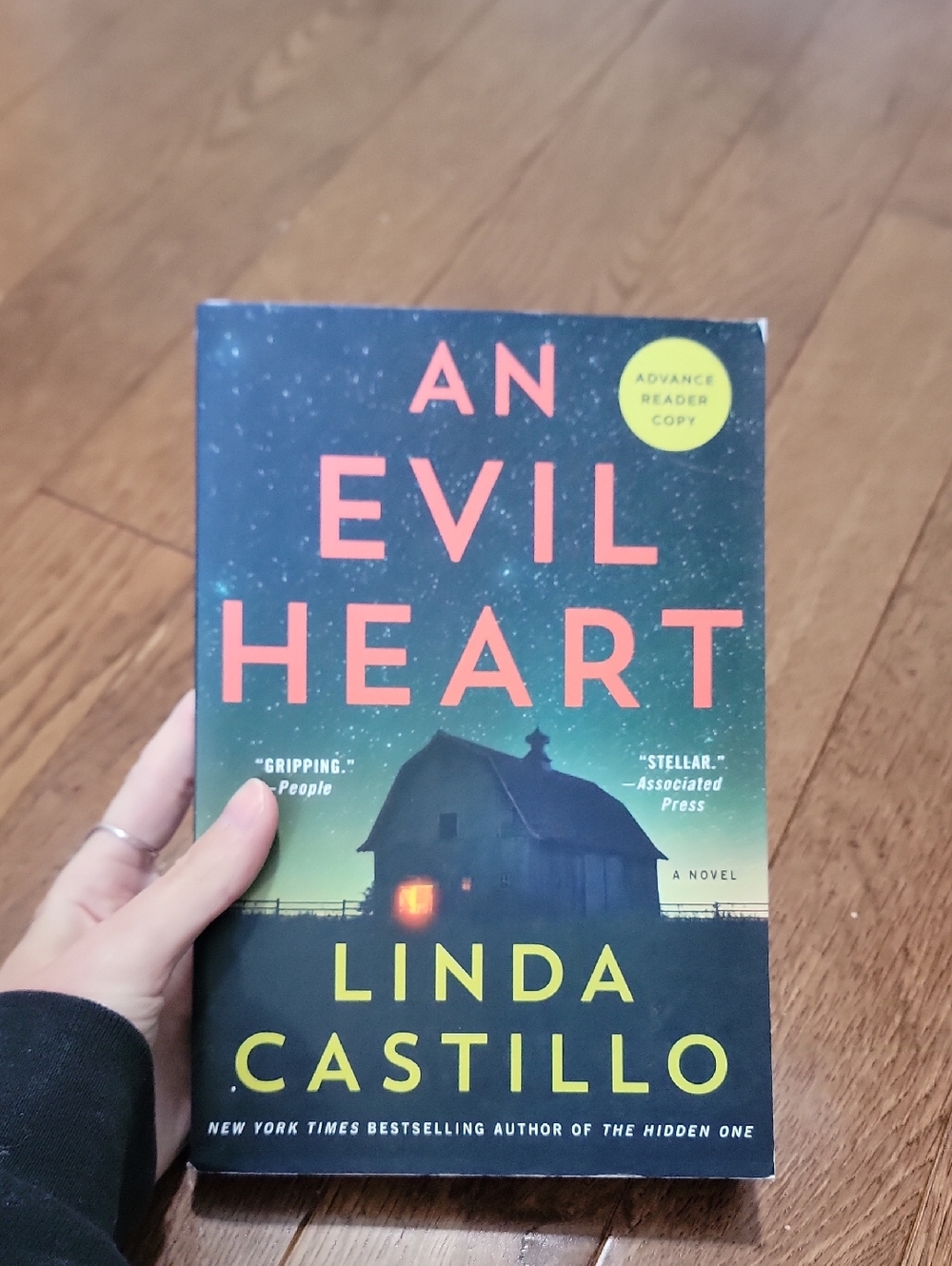 An Evil Heart by Linda Castillo - Dark Teal & Coral Cover